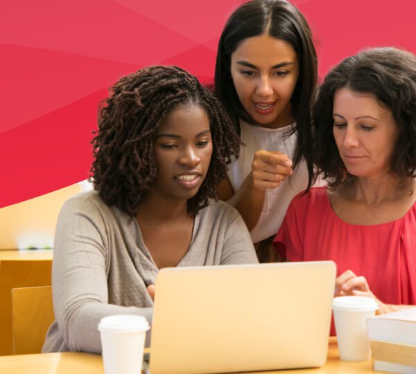 Students and teacher working on computer.