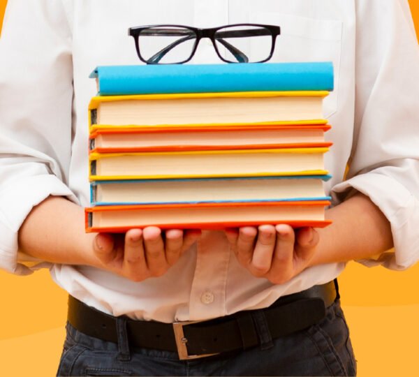 Student holding stack of books.